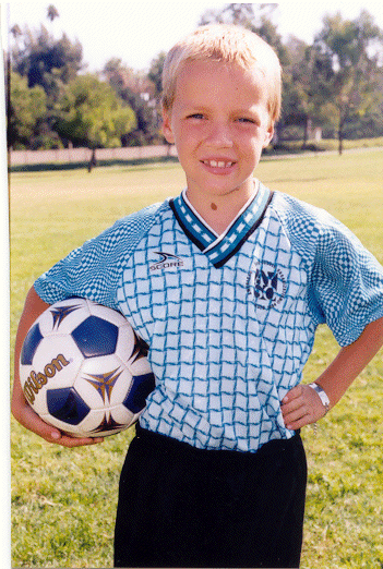 Chris playing AYSO soccer